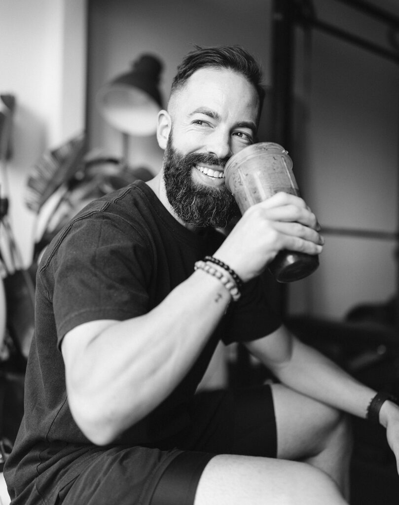 coach mike levine of mindful method drinking a smoothie, image in black and white